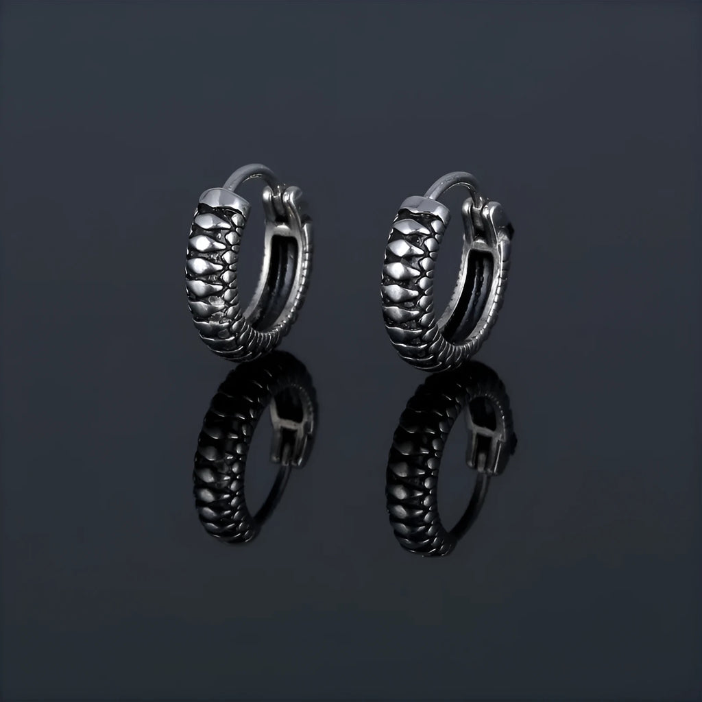 Silver geometric earrings with a retro twist striped pattern, made from titanium steel.