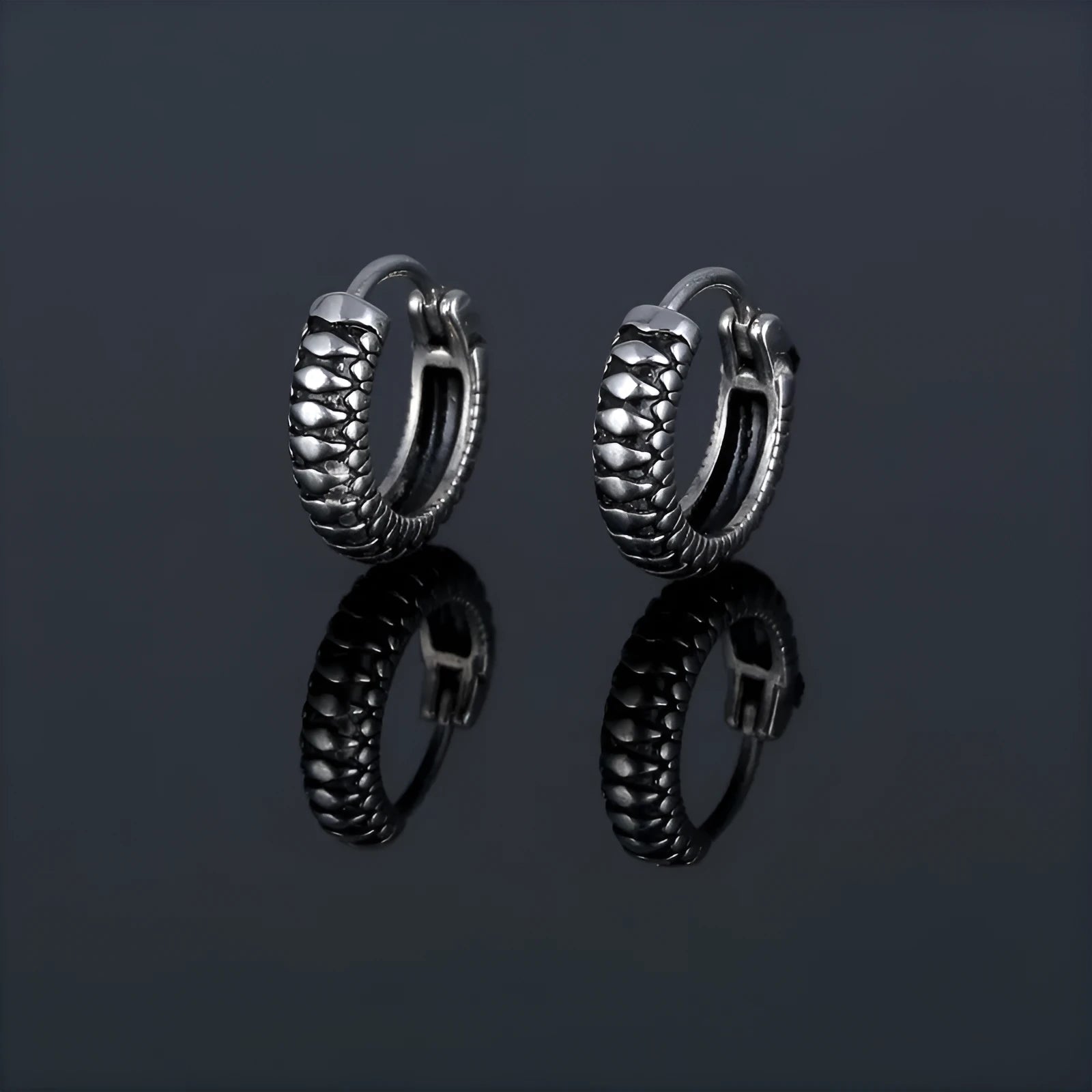 Silver geometric earrings with a retro twist striped pattern, made from titanium steel.