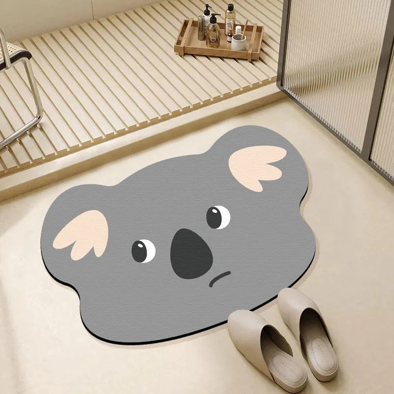 Cute animal cartoon design diatom oil absorbent non-slip bathroom mat on tiled floor.