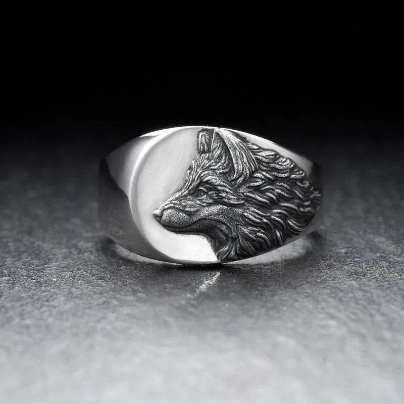 Silver geometric wolf head men's ring shown from multiple angles on a hand