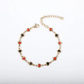 Stainless steel heart-shaped bracelet with 18K gold colour plating on a wrist, showing adjustable 17+5cm length.