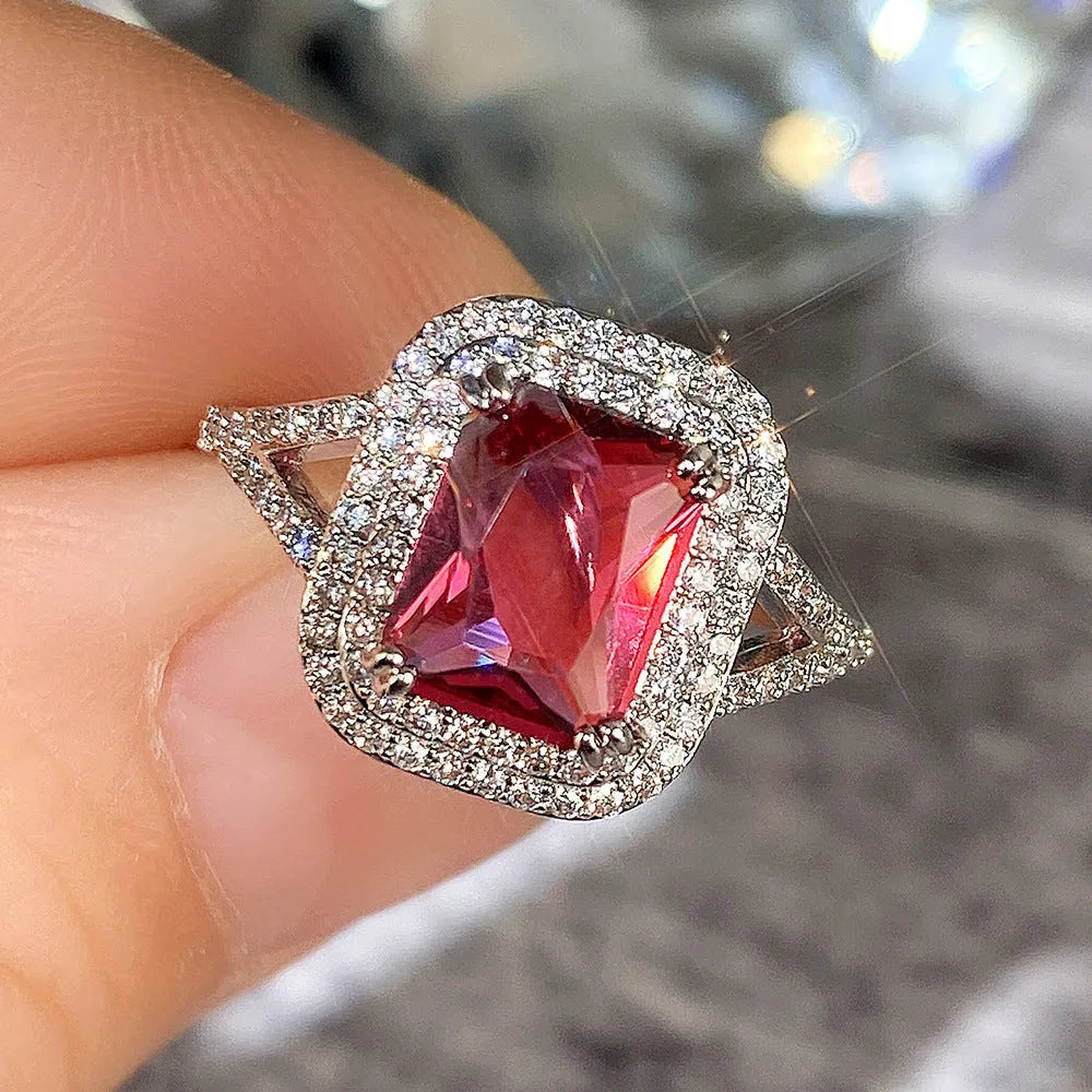 Red copper square geometric ring with rhinestone centrepiece for women, showing metallic construction