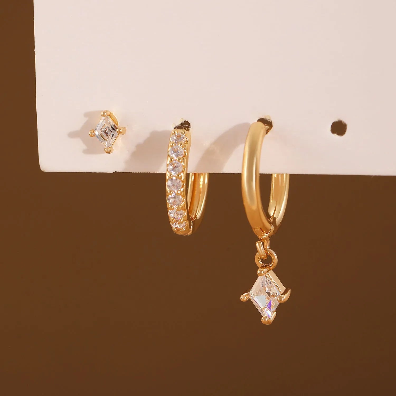 Ladies three-piece earring set with copper zircon geometry designs in gold and silver colours