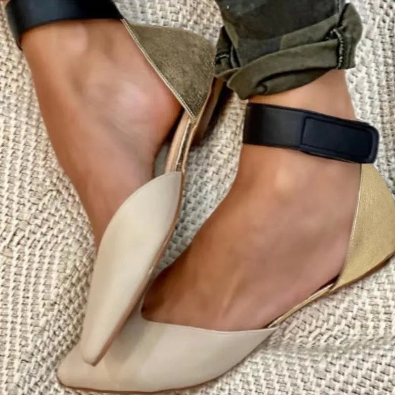 Women's beige velcro-strap sandals with hollowed pattern design on the flat upper.