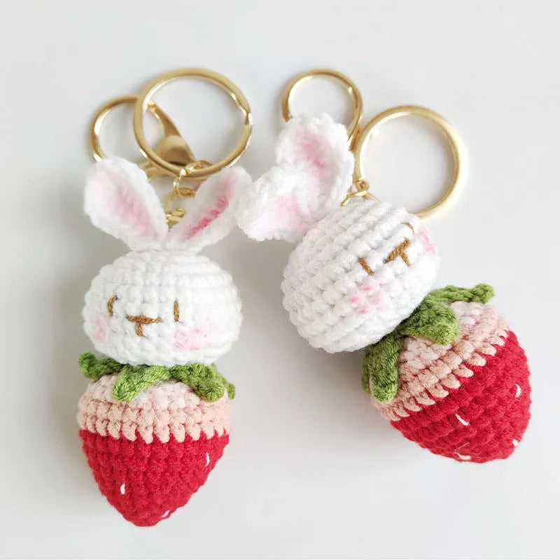 Hand-woven white wire pendant with rabbit strawberry cartoon design and key attachment