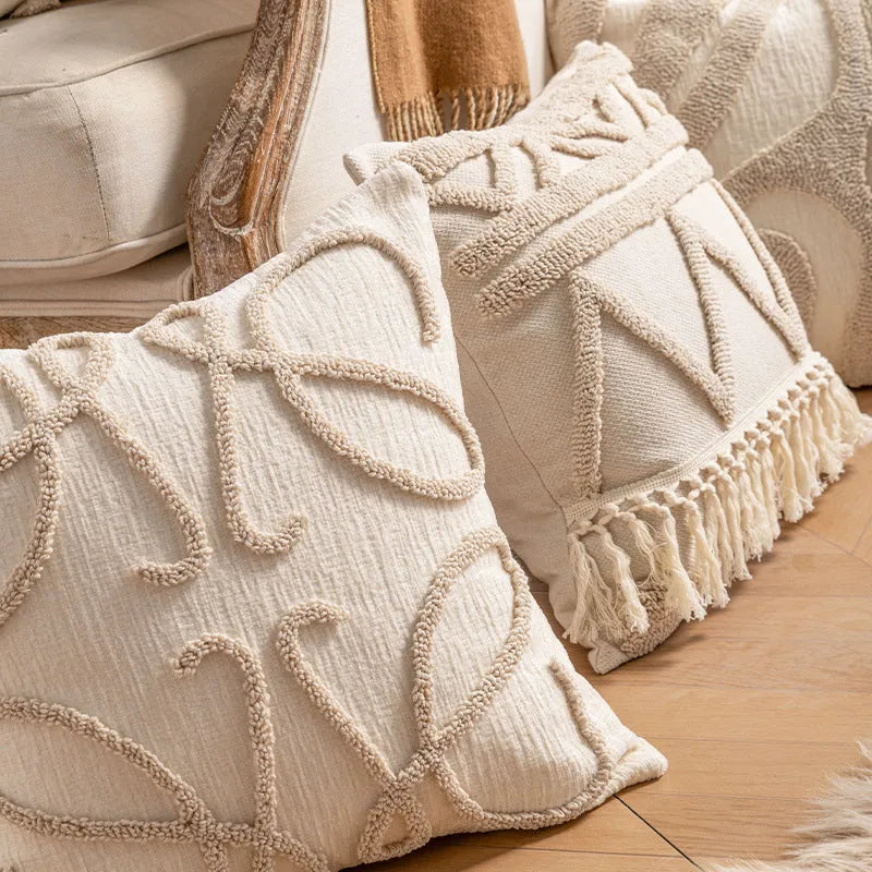 Knitted striped cushion cover with tassel detail in spiral dots design, shown in 45x45cm size.