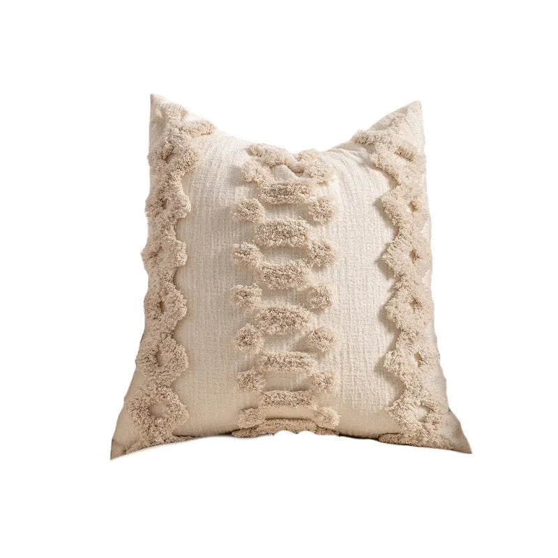 Knitted striped cushion cover with tassel detail in spiral dots design, shown in 45x45cm size.