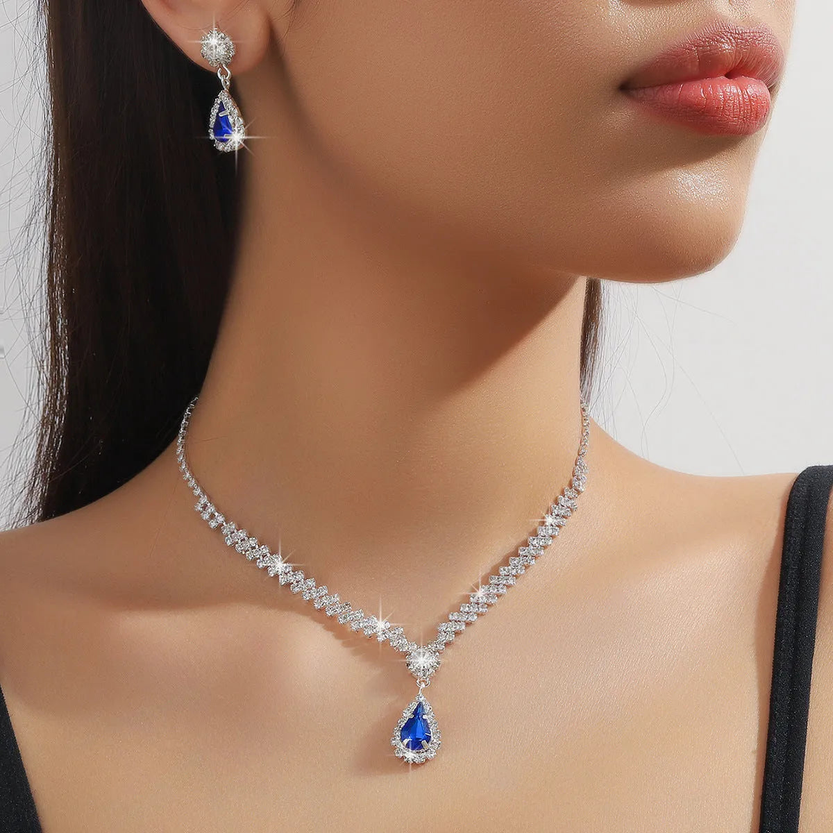 Claw chain necklace and earrings set with water drop rhinestone pendants in multiple colour options