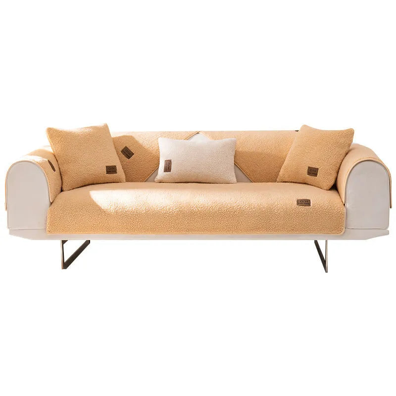 Lambswool sofa slipcover in blue on a three-seater sofa with matching cushion cover.