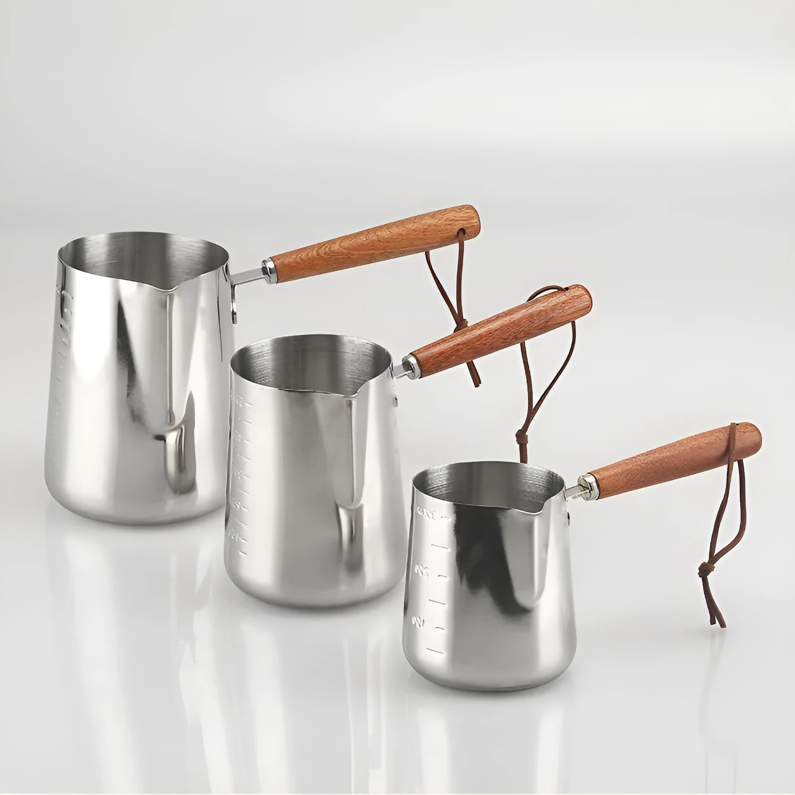 Stainless steel coffee cup with measurement scale markings and wooden handle shown in solid colour