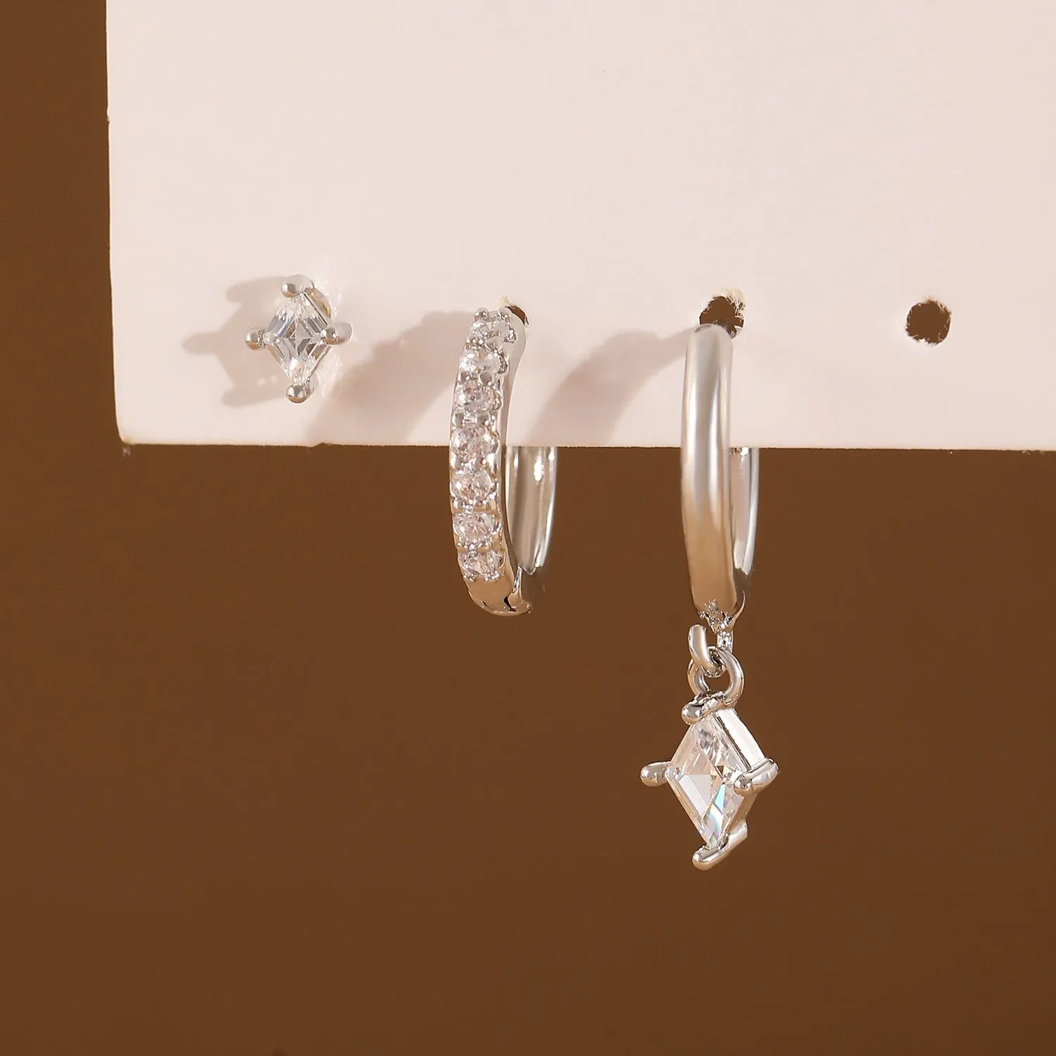 Ladies three-piece earring set with copper zircon geometry designs in gold and silver colours