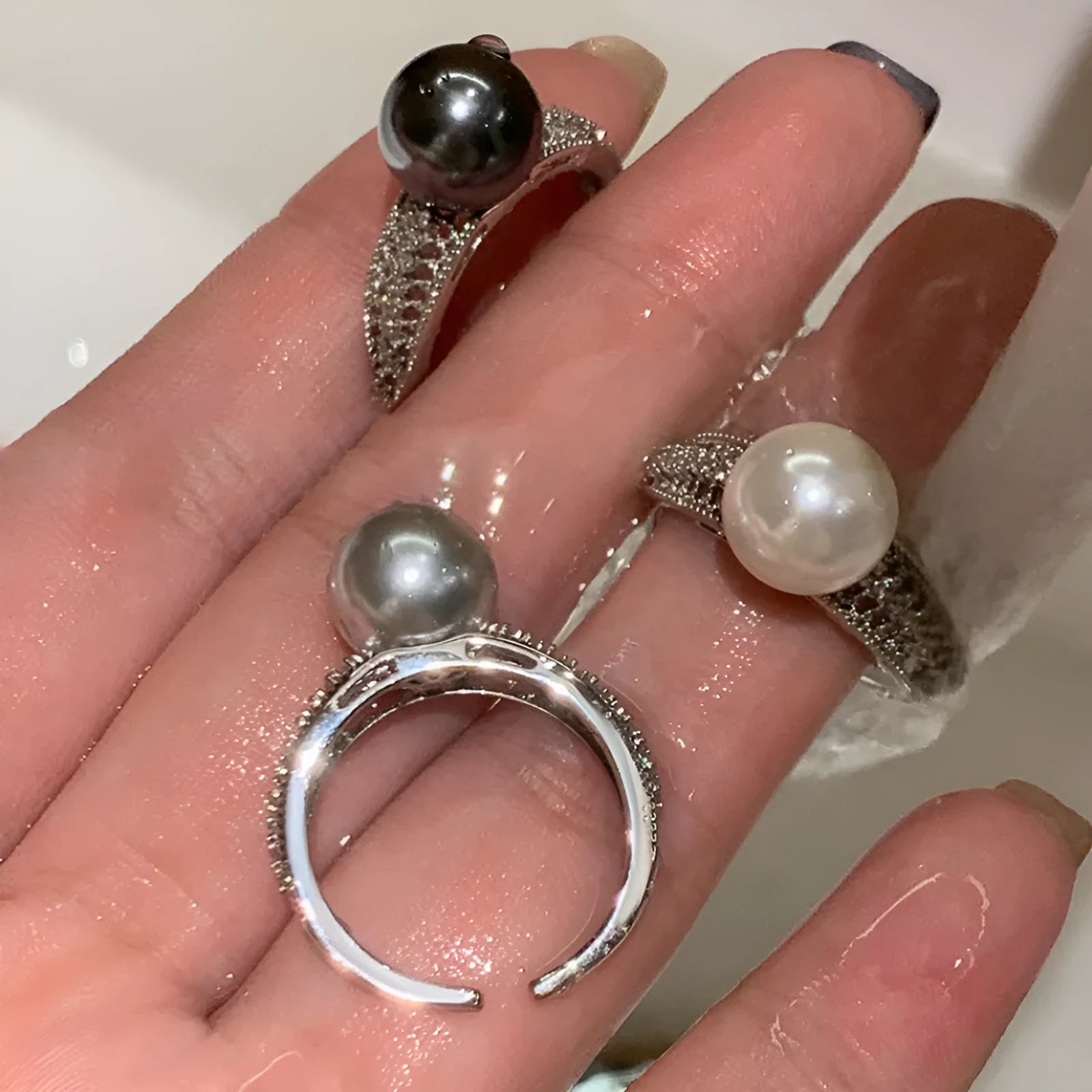Women's adjustable open ring with geometric design and black pearl finish on copper.