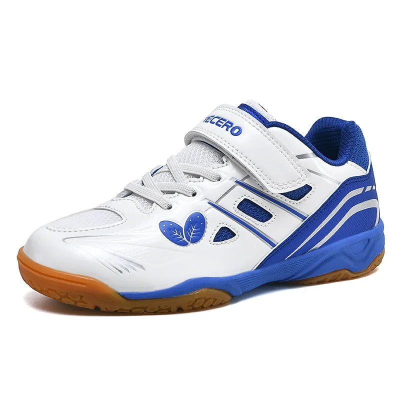 White and blue low-top casual badminton shoes with ribbed sole on a court surface.