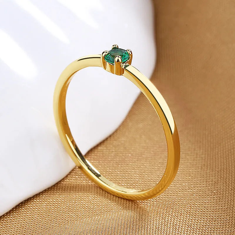 Women's personalised copper ring with a single diamond, shown in white, red, green, and blue colour options.