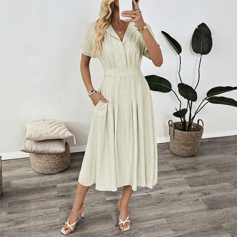 Light green lapel shirt dress with waist-tight skirt and pocket for office wear.