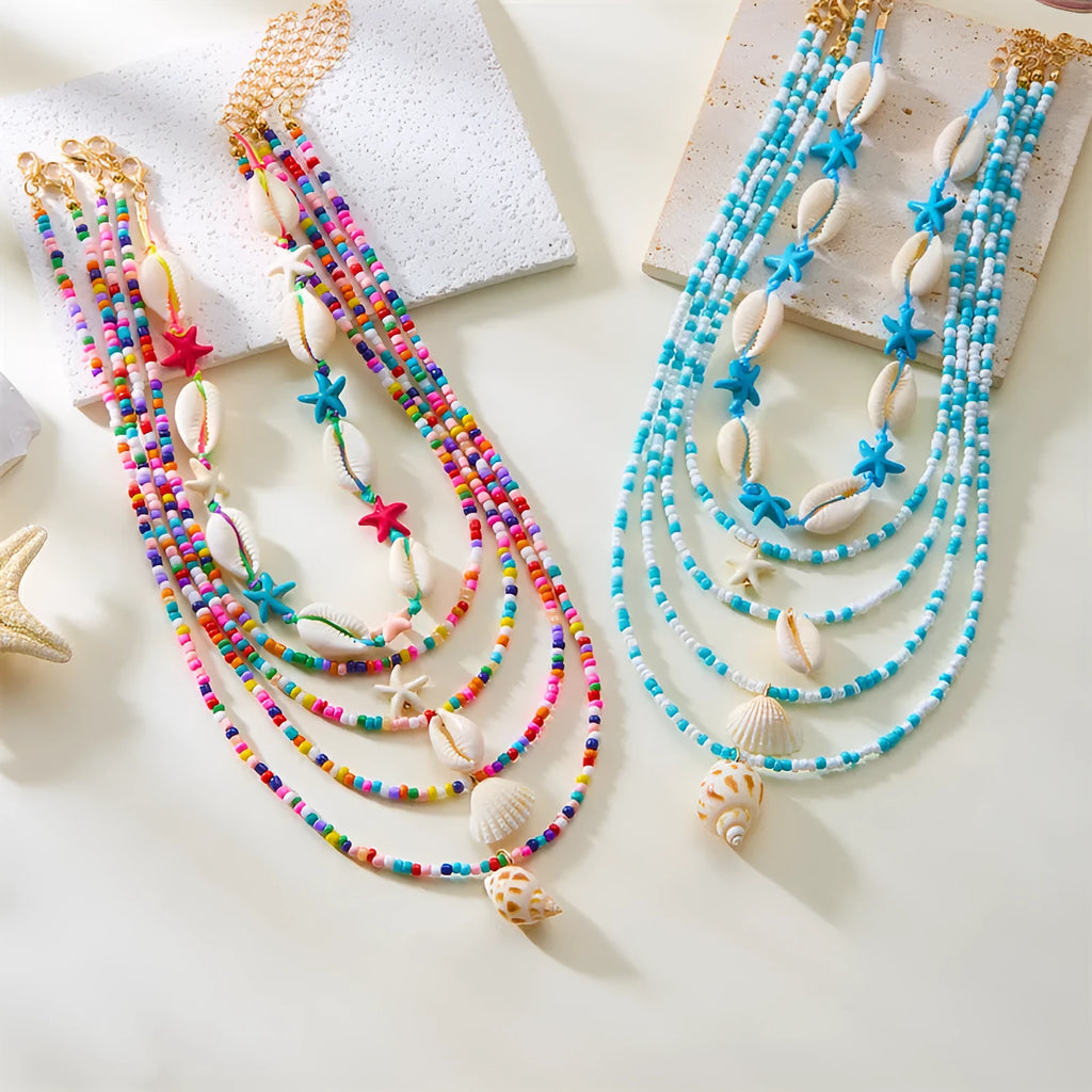 Five-piece women's necklace set with shell beads and adjustable chains in blue and coloured variations