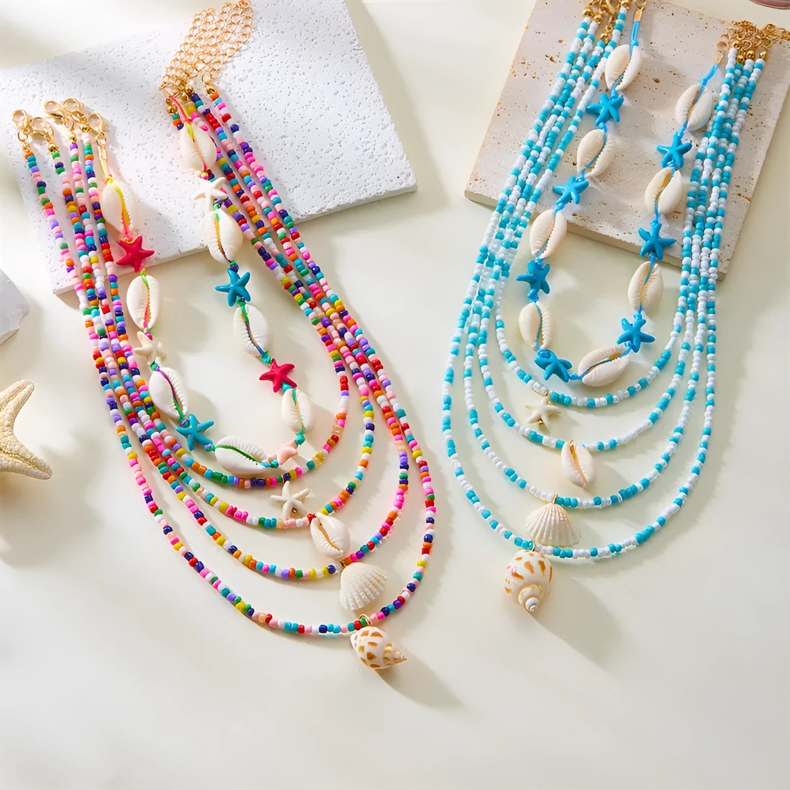 Five-piece women's necklace set with shell beads and adjustable chains in blue and coloured variations