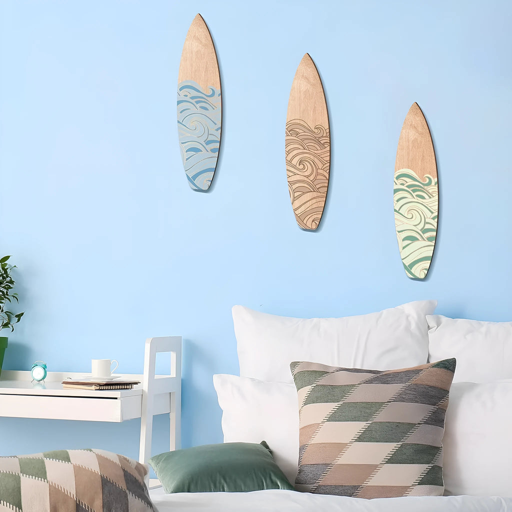 Three identical wooden surfboard wall decorations with European-style design on boxwood
