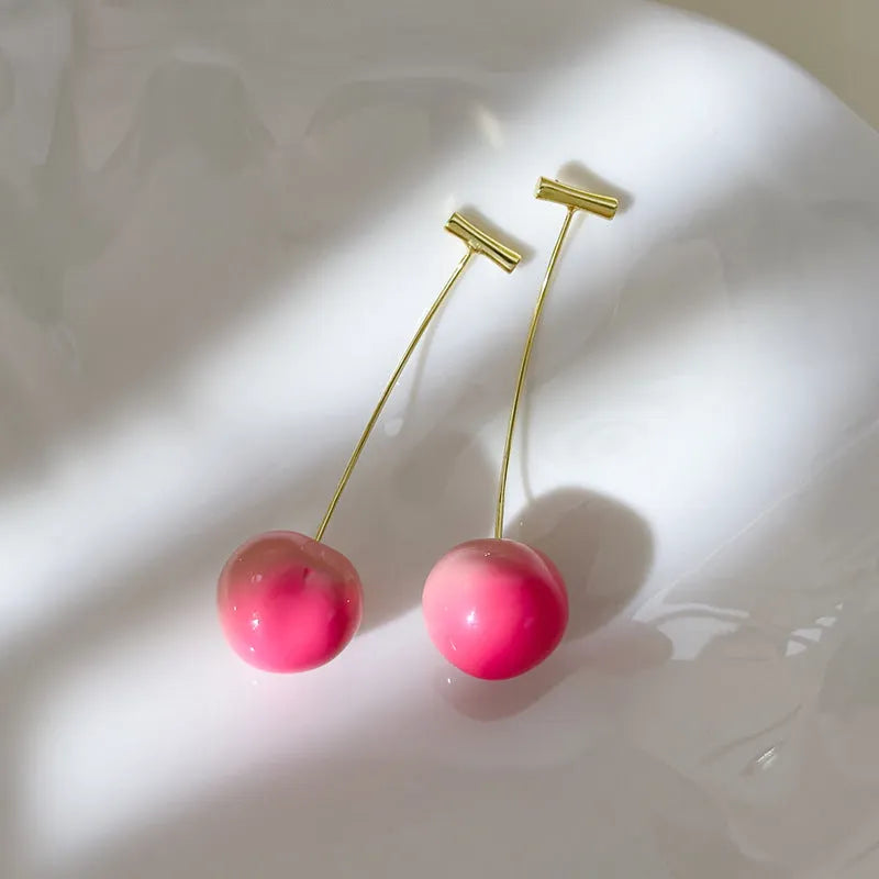 Acrylic peach fruit earrings in small and large size variations with copper findings