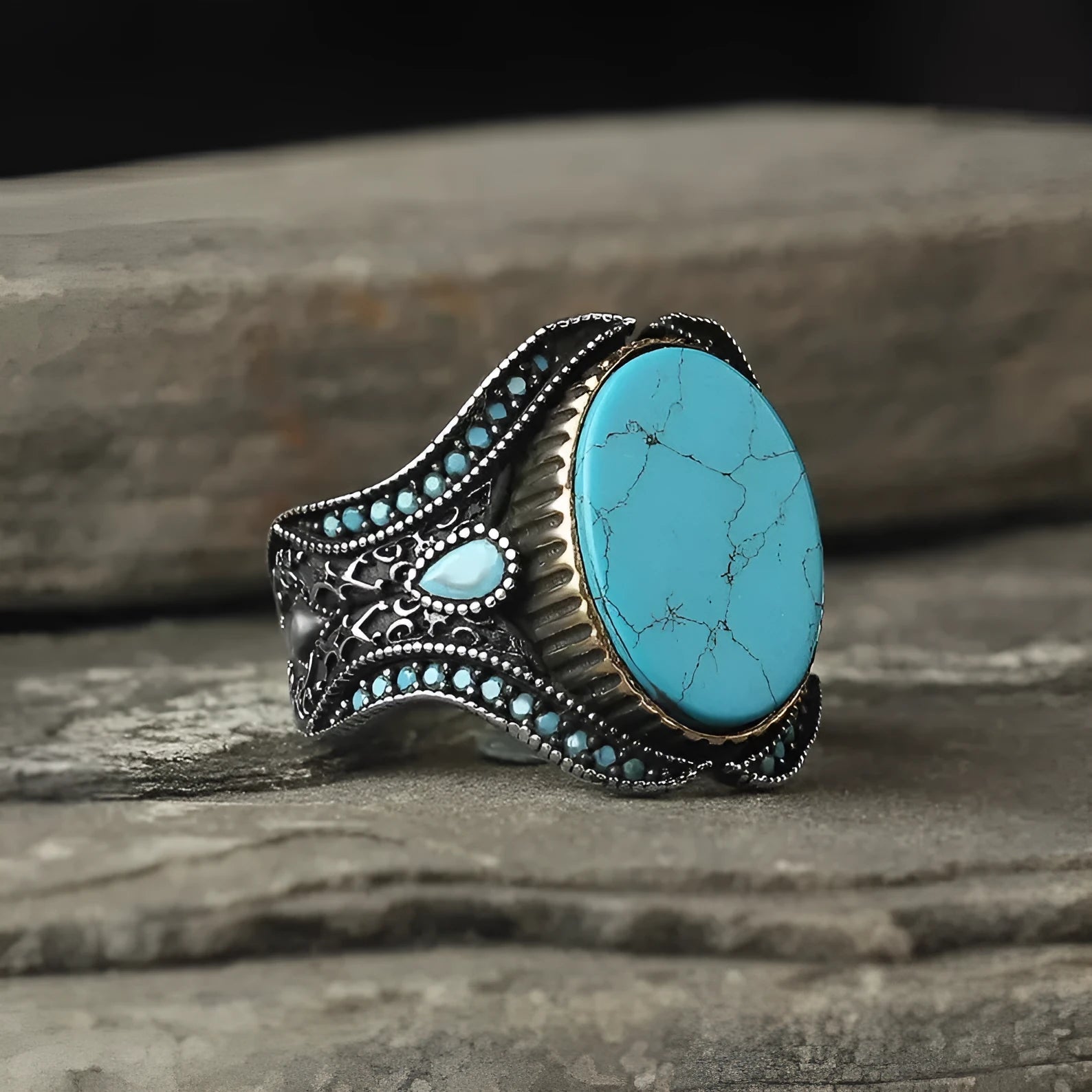 Men's round turquoise ring in antique silver alloy showing simple design and stone setting