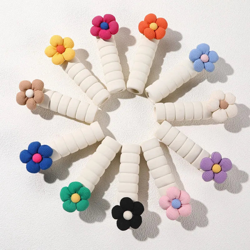 Flower pattern soft PEVA door handle protective cover on a round door knob.