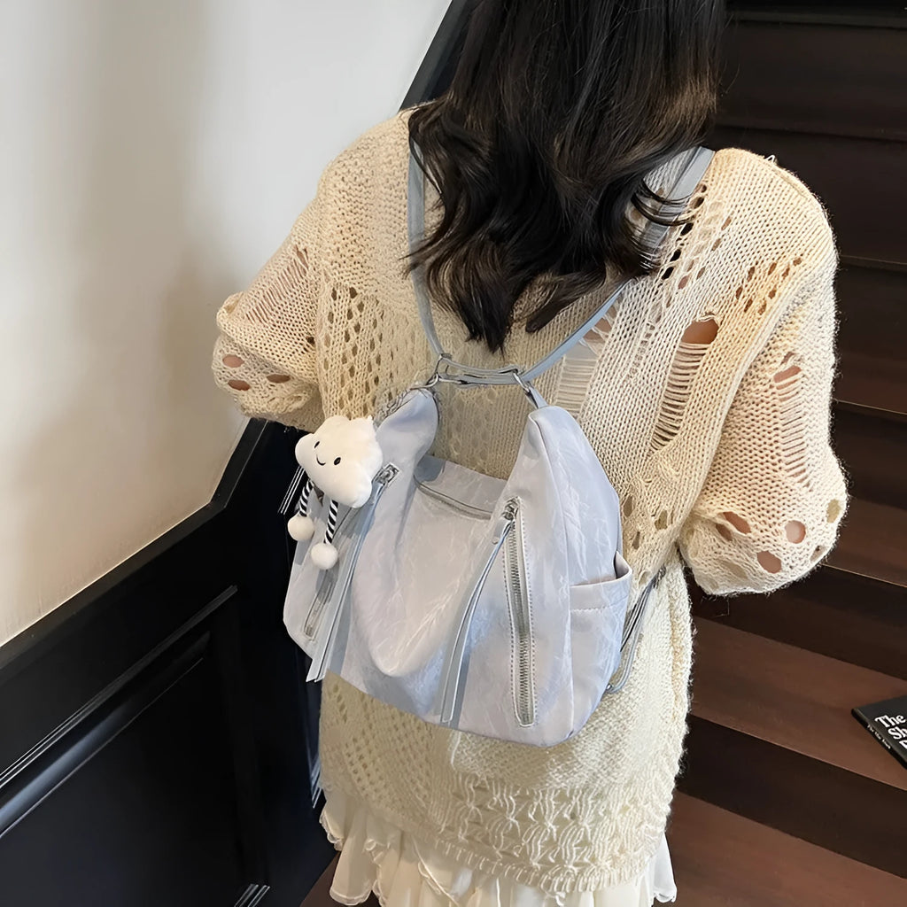 Women's soft PU fashion backpack in black colour with pendant accessory