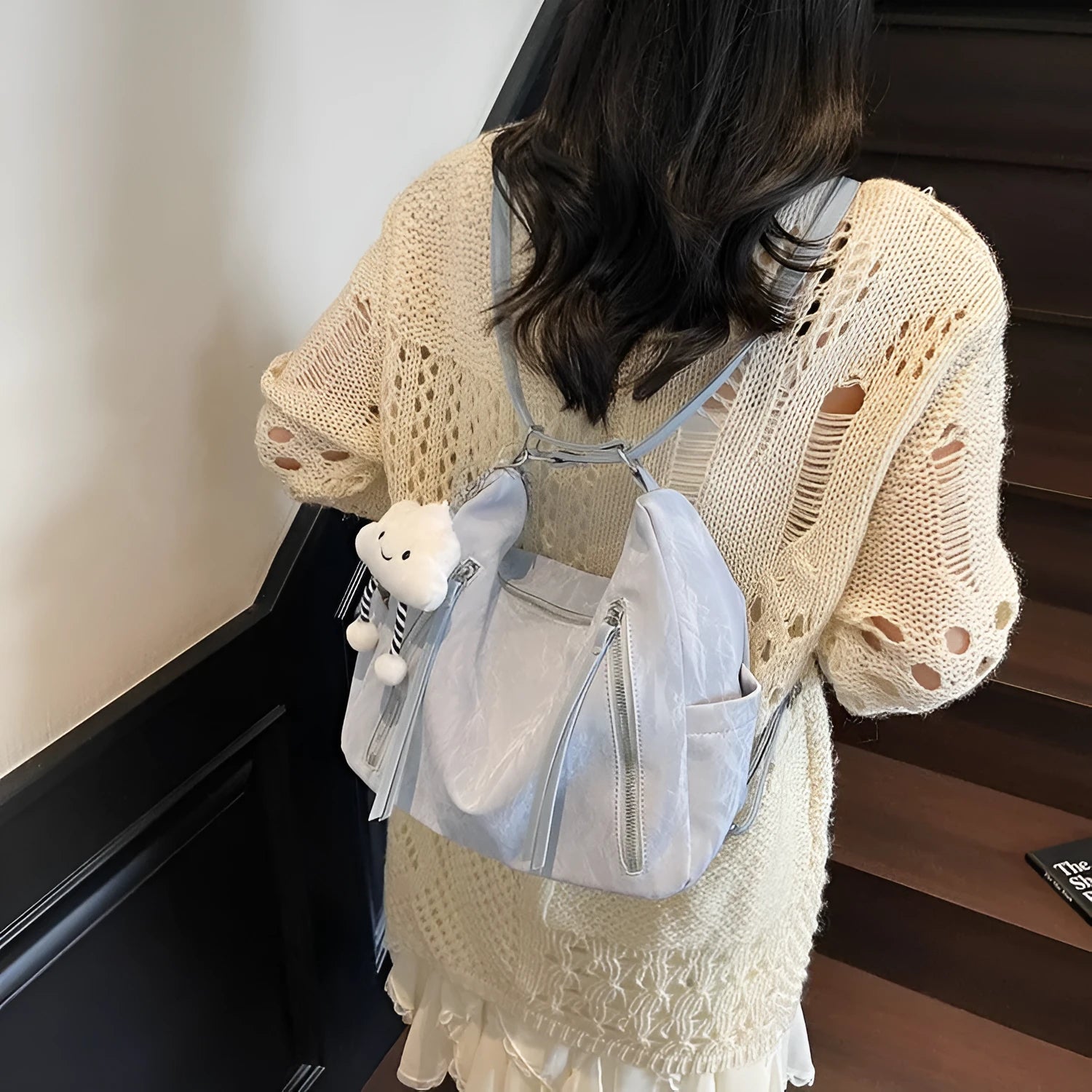 Women's soft PU fashion backpack in black colour with pendant accessory