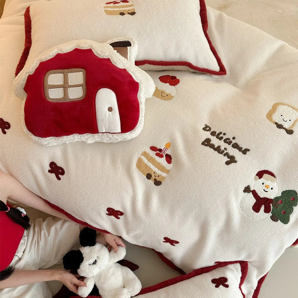 Winter Christmas cartoon pattern four-piece polyester bedding set showing heart design on duvet cover and pillowcases.