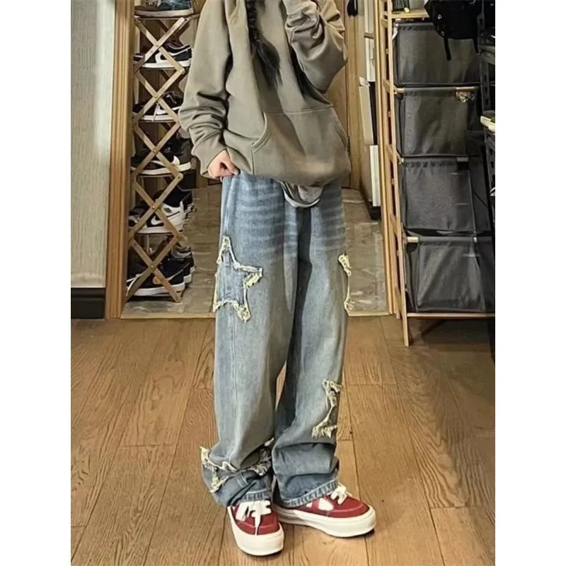 Blue high-waist straight-leg women's denim trousers on a hanger.