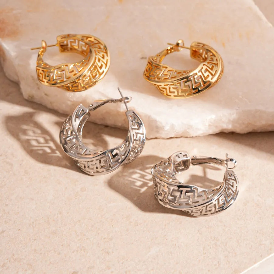Women's geometric hollow stud earrings with twisted round design in gold or silver finish