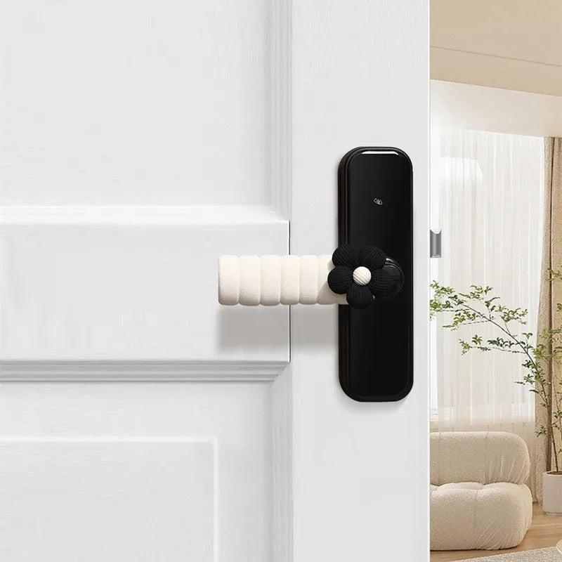 Flower pattern soft PEVA door handle protective cover on a round door knob.