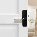 Flower pattern soft PEVA door handle protective cover on a round door knob.