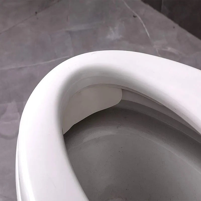 White PVC toilet urine blocking board for children's potty training splash prevention.