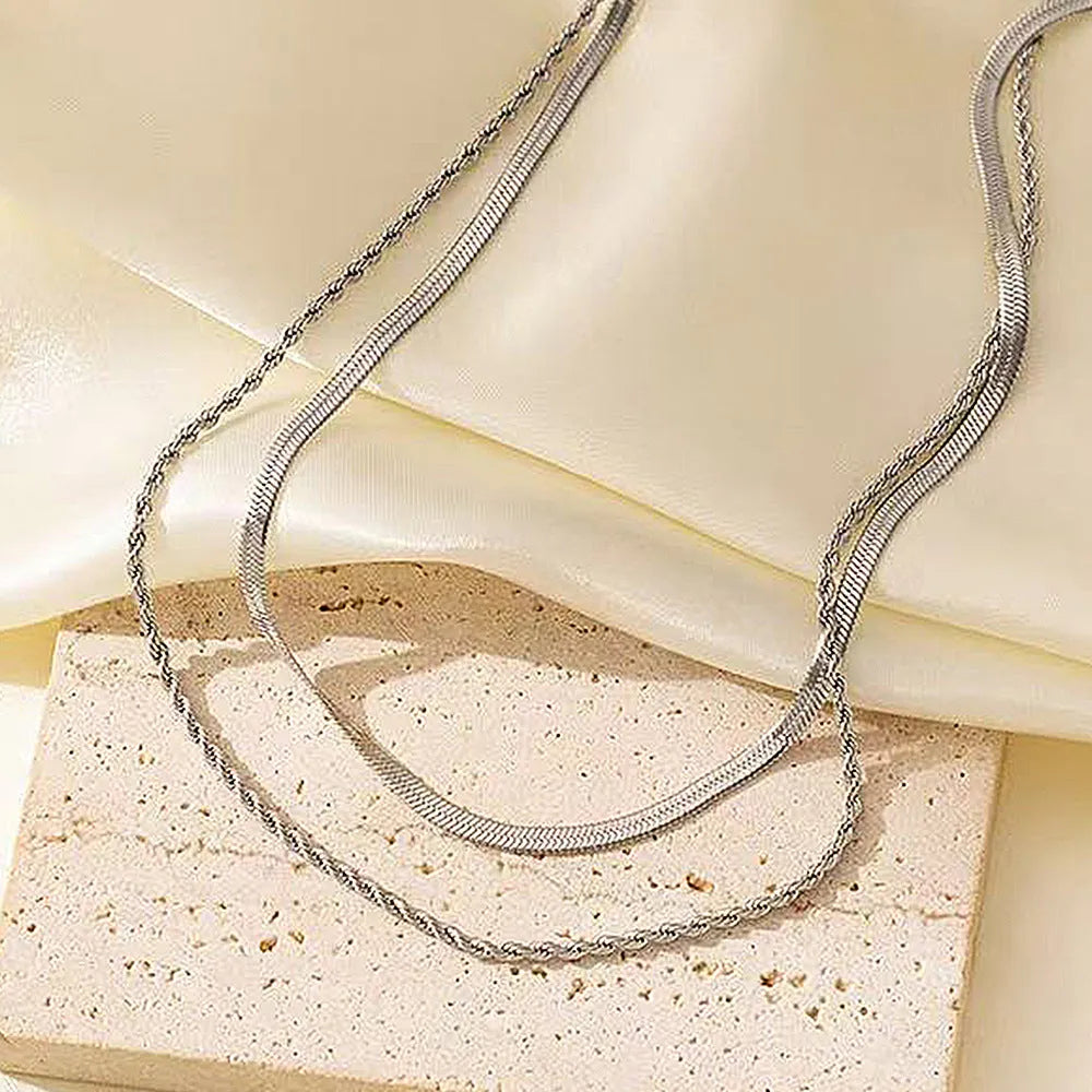 Women's retro double-layer twist necklace with geometric titanium steel pendant on adjustable snake bones chain