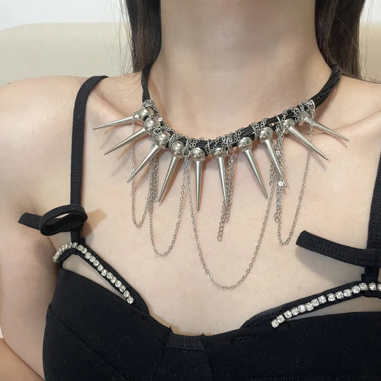 Women's casual leather necklace with winding round beads, tassel pendant, and silver rivet details