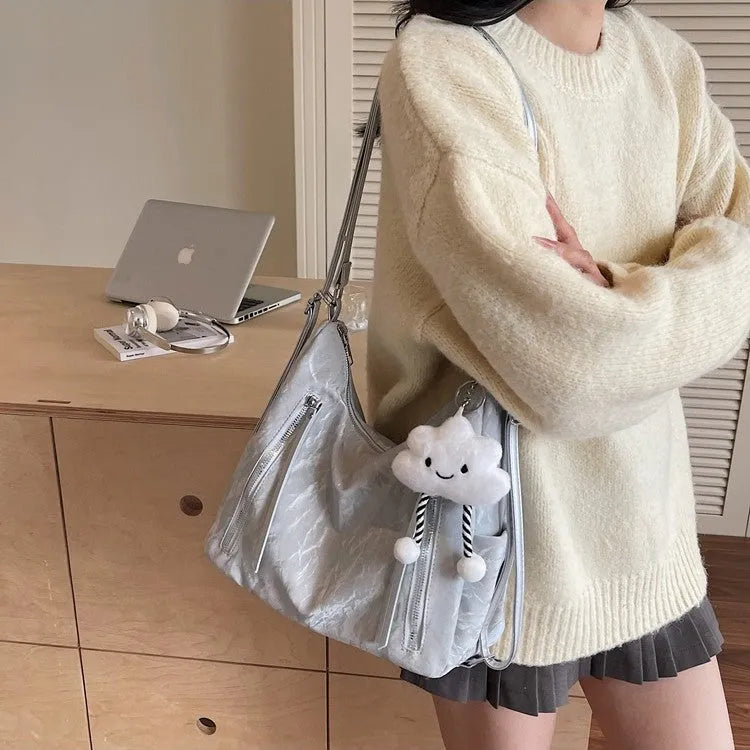 Women's soft PU fashion backpack in black colour with pendant accessory