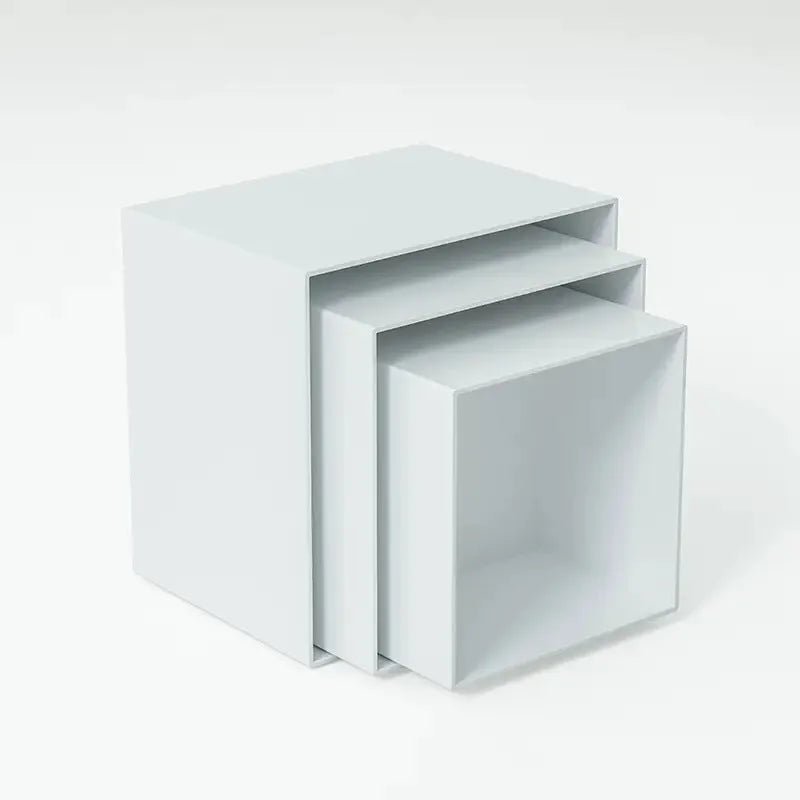 White plastic cube dessert display stand with six modular stacking components for cake presentation