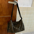 Leopard print sports style cross-body messenger bag with large capacity and durable stitching