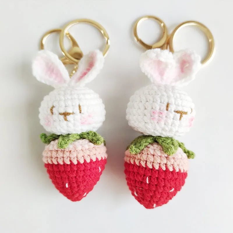 Hand-woven white wire pendant with rabbit strawberry cartoon design and key attachment