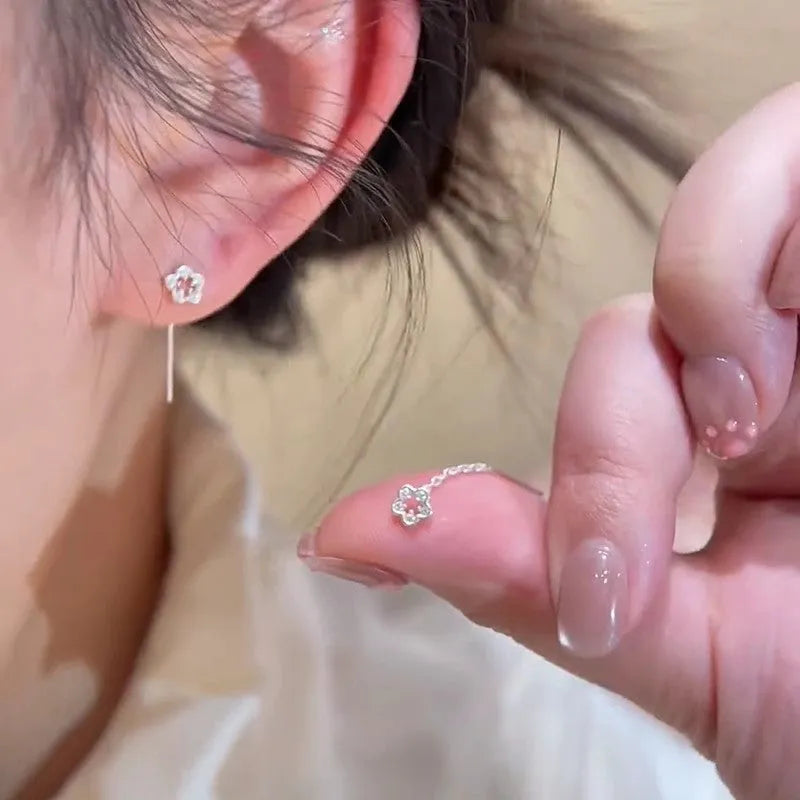 Silver colour hollow flower stud earrings with petal design on alloy posts