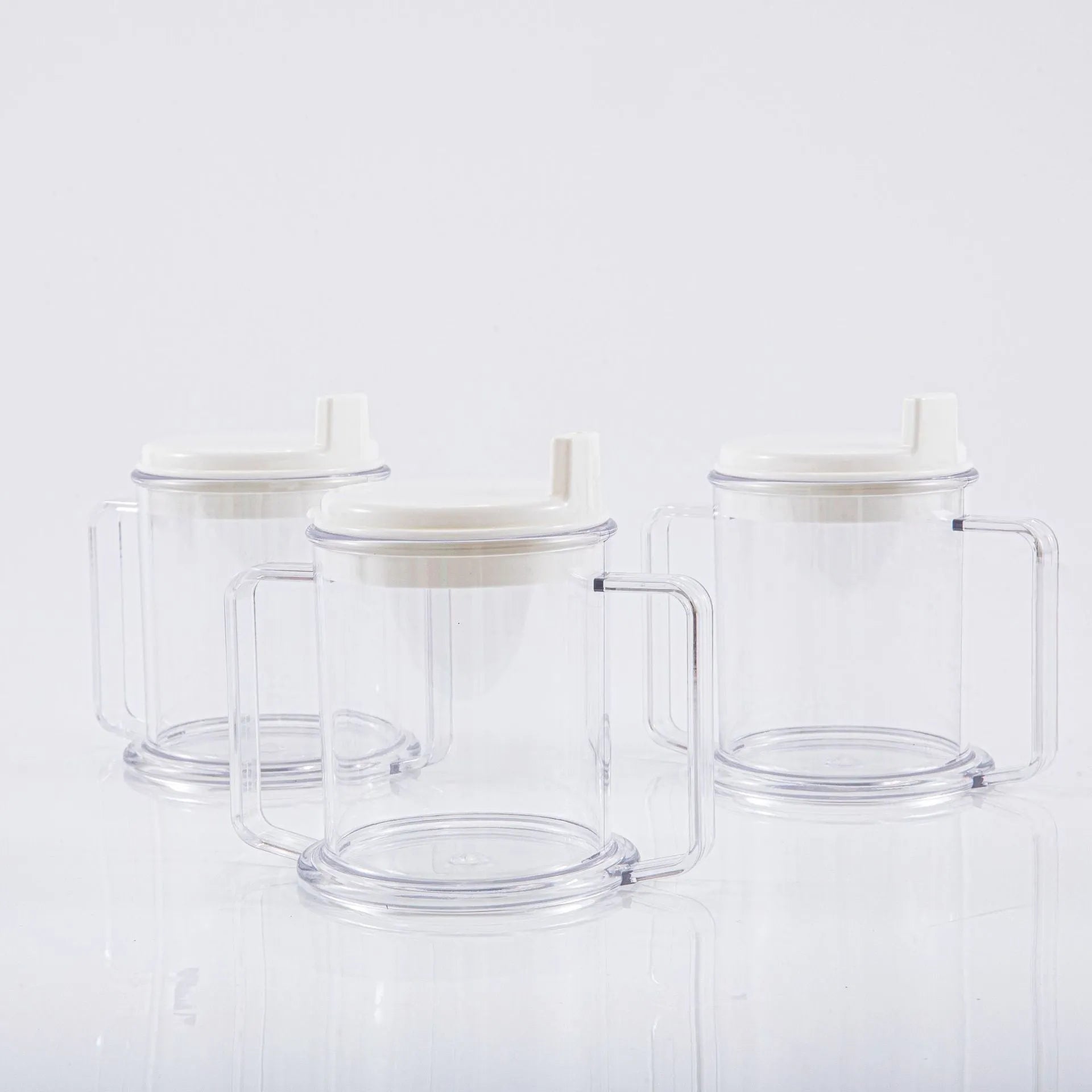 Transparent plastic drinking cup with spill-proof lid showing 14cm height and 12cm diameter dimensions