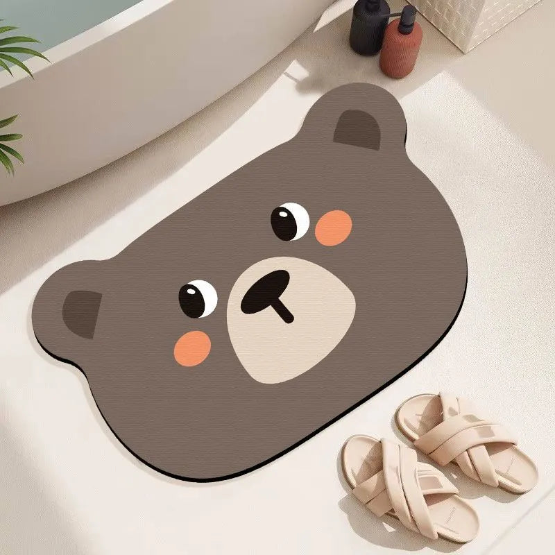 Cute animal cartoon design diatom oil absorbent non-slip bathroom mat on tiled floor.