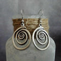 Retro geometric spiral earrings with distressed silver finish measuring 2.6 by 5 centimetres