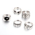 A black alloy ring for women featuring a raised retro poker card spade design.