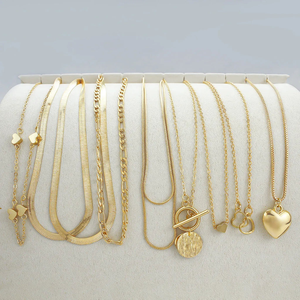 Women's gold electroplated 10-piece necklace set with snake bone chain and adjustable length