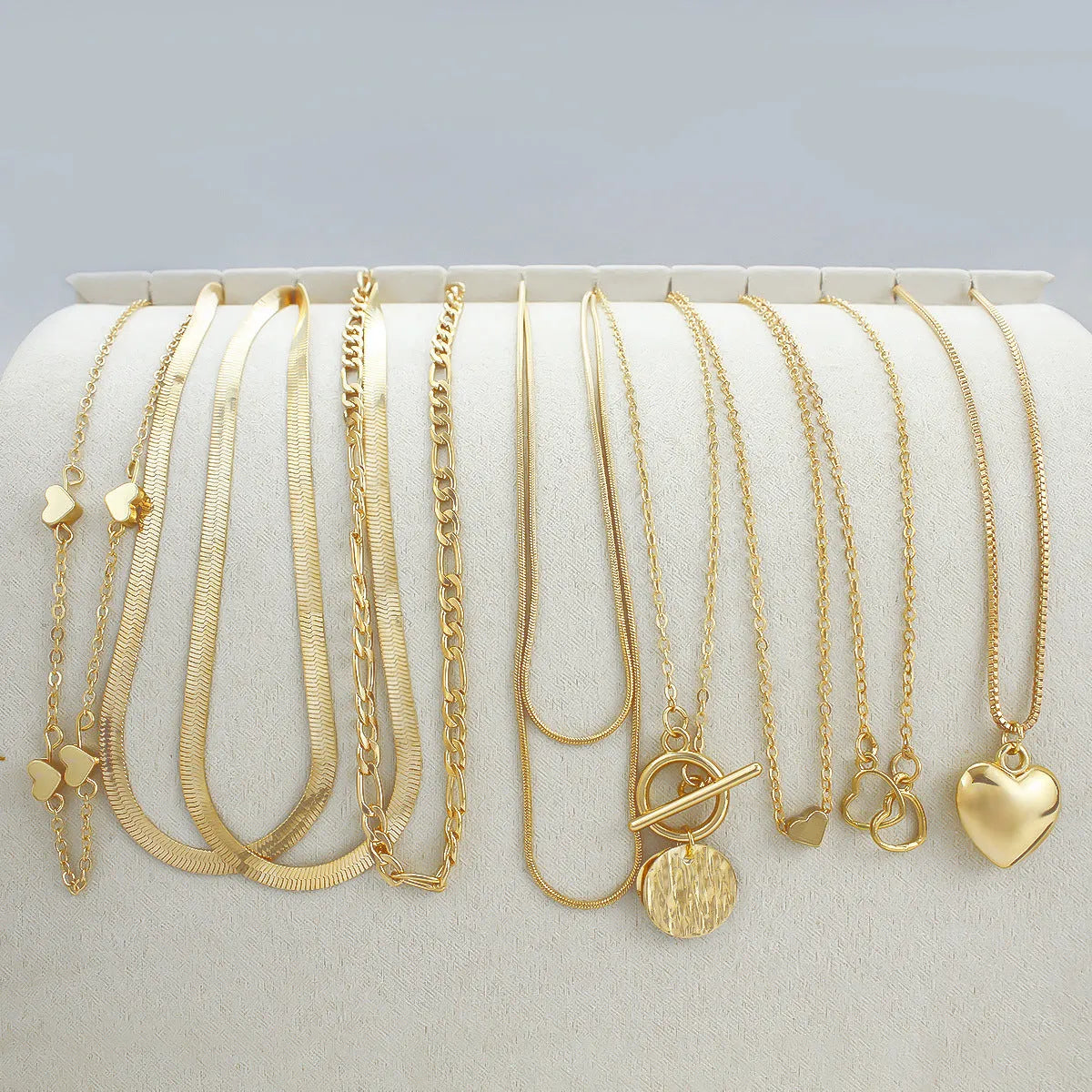 Women's gold electroplated 10-piece necklace set with snake bone chain and adjustable length