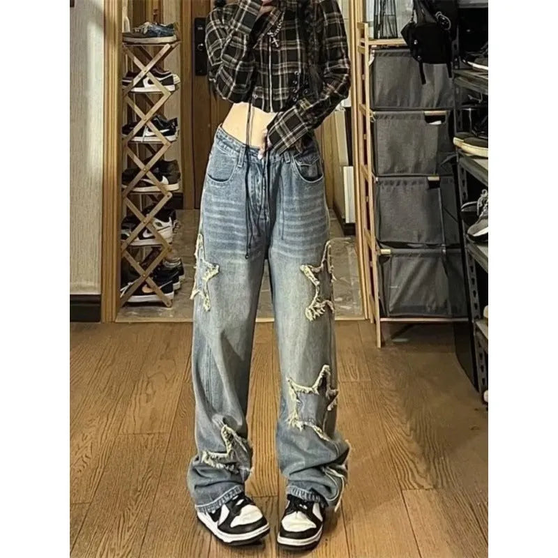 Blue high-waist straight-leg women's denim trousers on a hanger.