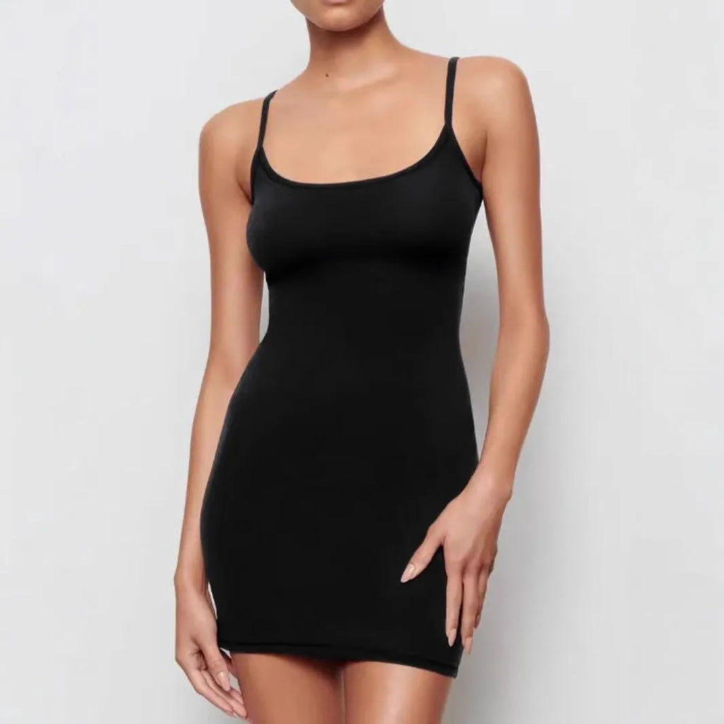 Black slim-fit sling sheath dress on a mannequin, showing sleeveless design and mid-waist.