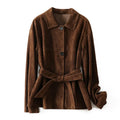 Women's caramel mocha cashmere coat with Peter Pan collar and belt, showing leather stitching and loose retro fit.