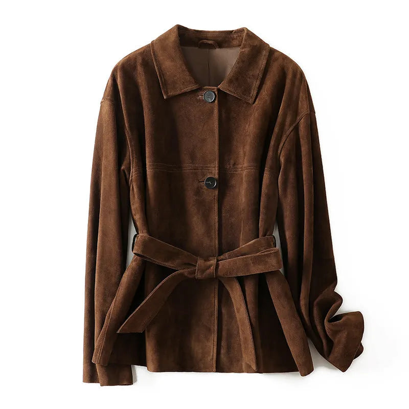 Women's caramel mocha cashmere coat with Peter Pan collar and belt, showing leather stitching and loose retro fit.
